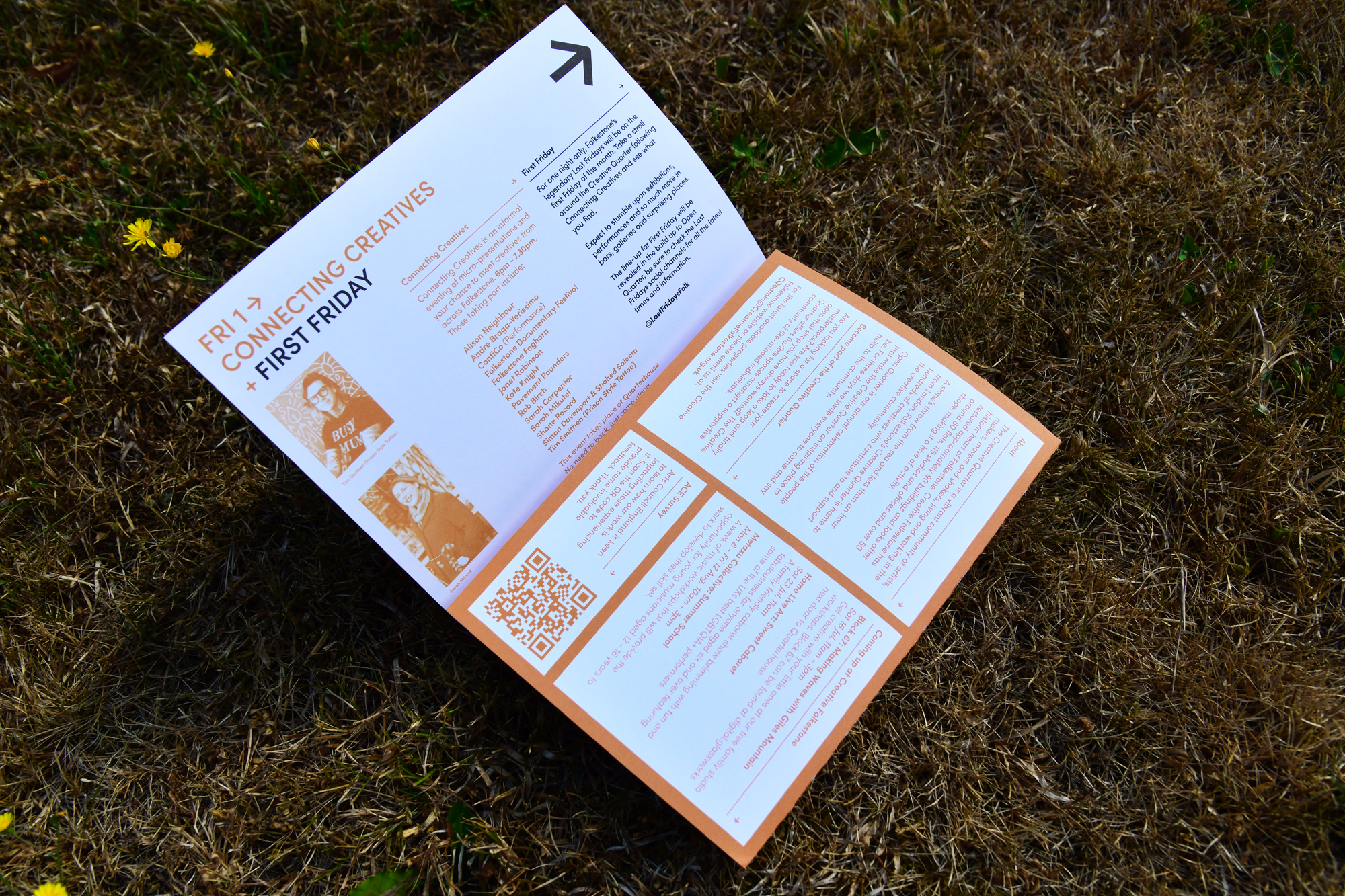 The Open Quarter fold-out programme lying open on grass, showing the First Friday and Connecting Creatives page in orange and white